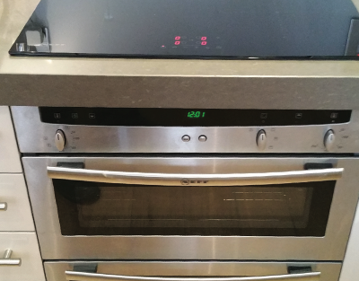 An integrated hob and oven